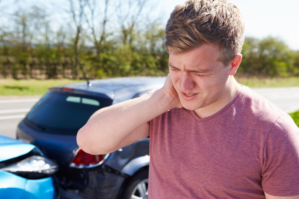 Driver Suffering From Whiplash After Traffic Collision